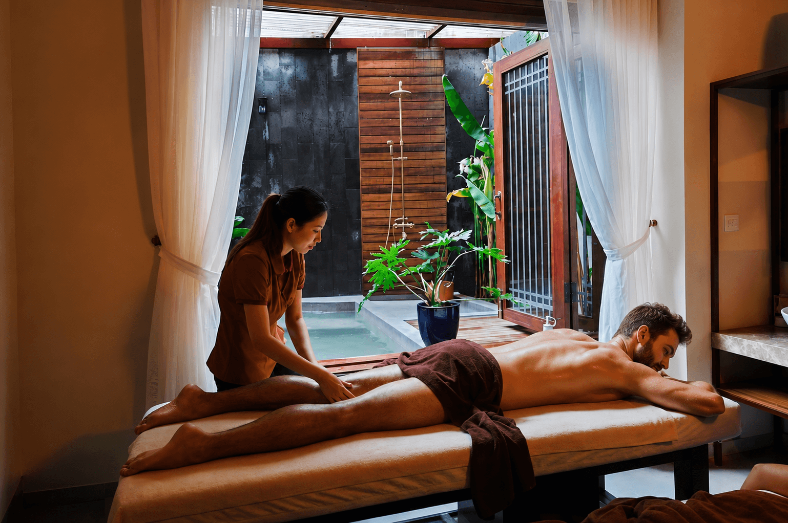 A therapist working on a guest at Nghê Prana spa, a Hoi An riverside hotel and Vietnamese herbal spa